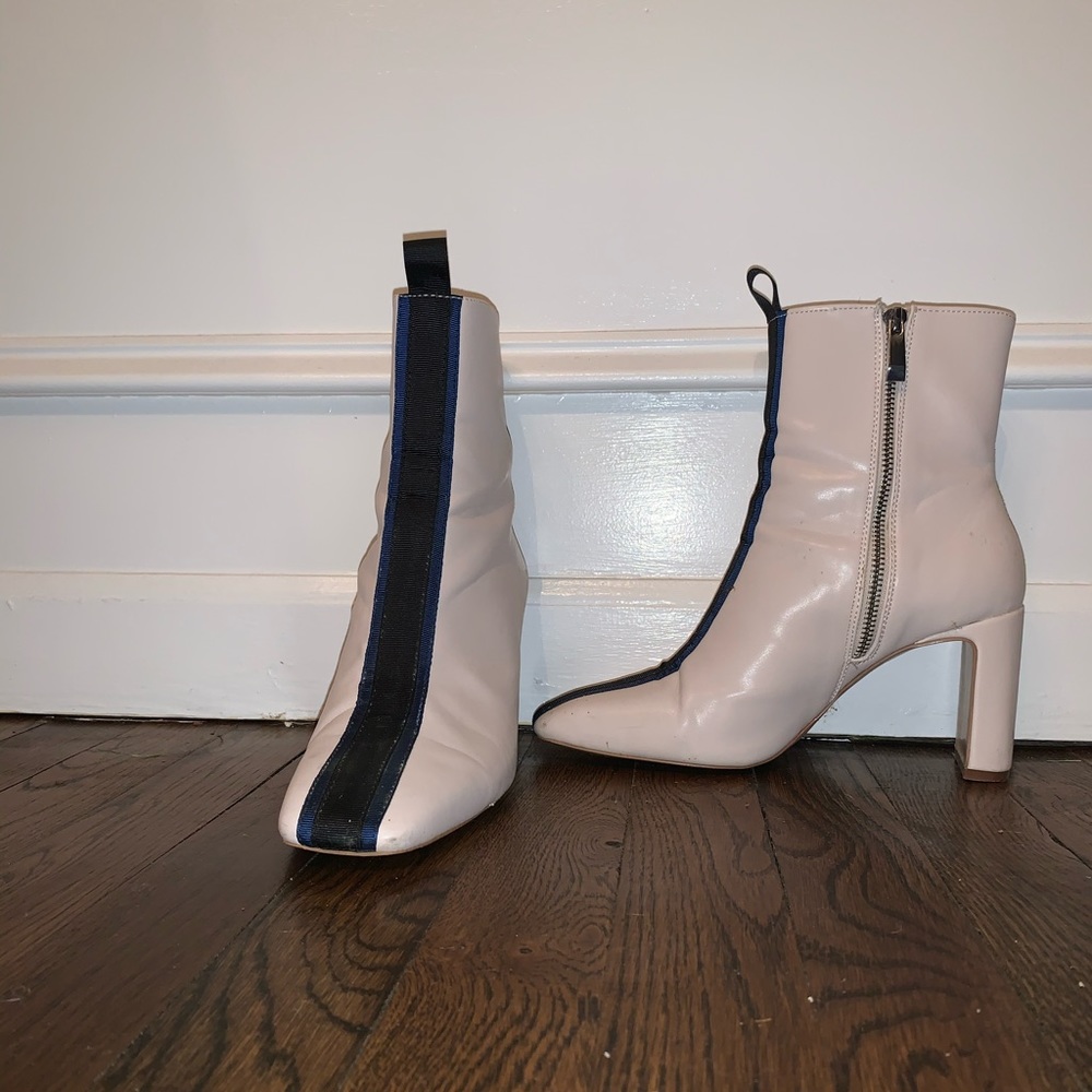 White boot with black and blue stripe